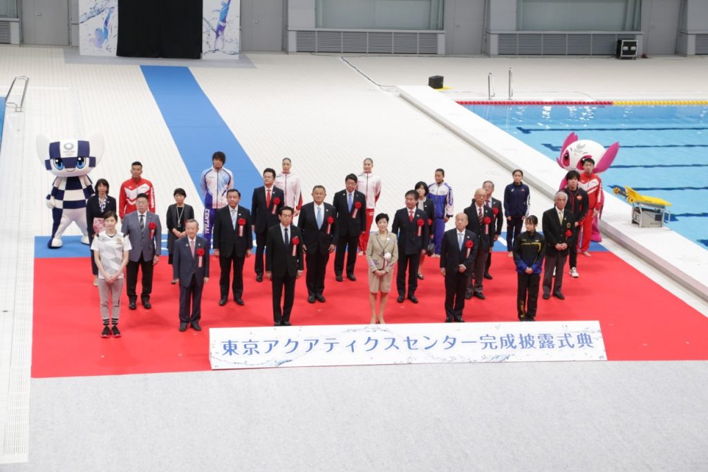 Officials and Tokyo governor gathering for photo session at Tokyo aquatic center after the grand opening ceremony that was postponed due to pandemic. (Arab News Japan)