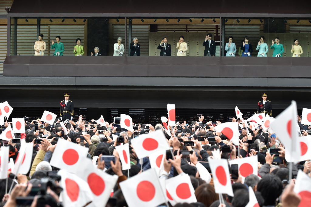 Japan's Emperor Naruhito (centre L), Empress Masako (centre R) and members of the royal family wave to well-wishers during a New Year's greetings at the Imperial Palace in Tokyo on January 2, 2020. (AFP)
