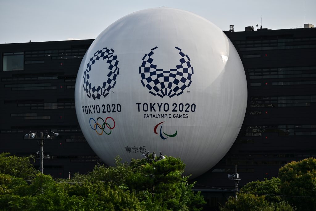 Japanese Prime Minister Yoshihide Suga, who sees tourism as key to reviving the economy, has vowed to do all it takes to ensure the coronavirus pandemic-delayed Olympics Games take place in 2021. (AFP)