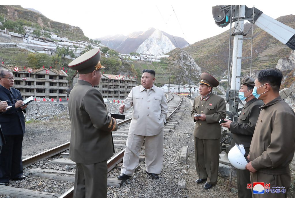 This undated picture released from North Korea's official Korean Central News Agency (KCNA) on October 14, 2020 shows North Korean leader Kim Jong Un (C) inspecting the rehabilitation site in the Komdok area of South Hamgyong Province, which was damaged by the typhoon. (AFP)