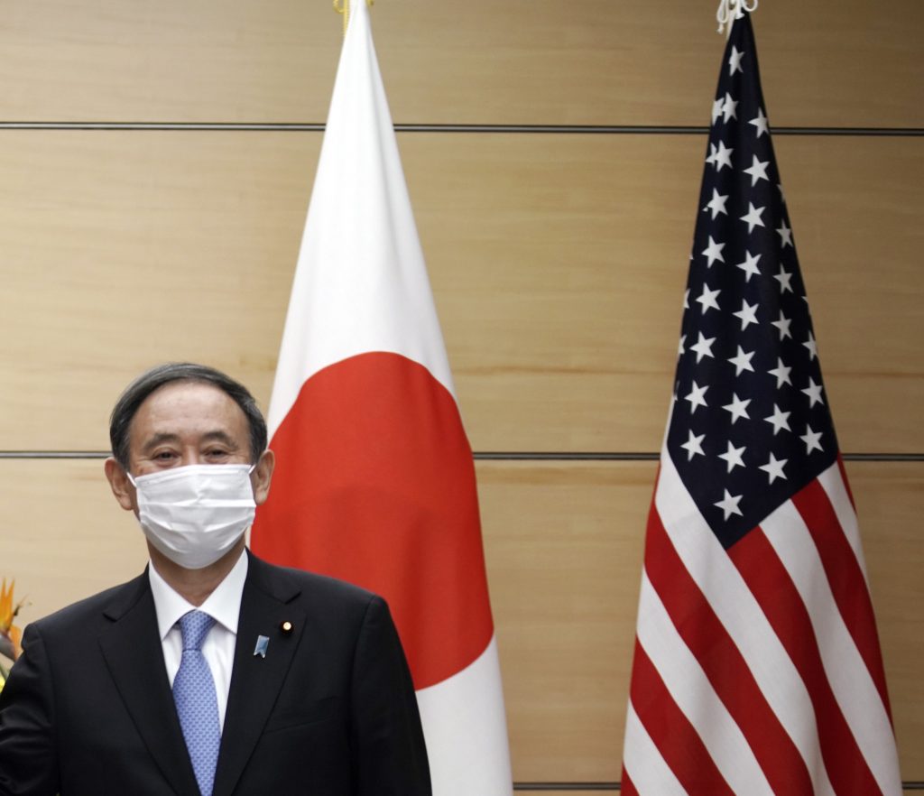 Japan's Prime Minister Yoshihide Suga (R) during his courtesy call at the prime minister's office in Tokyo, Oct. 22, 2020. (AFP)