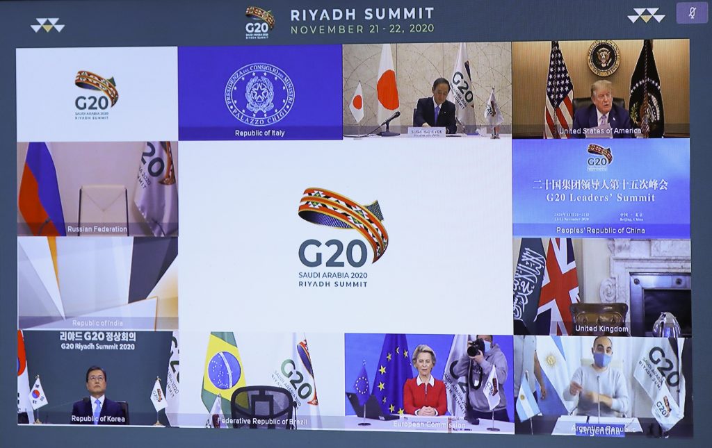 Japanese Prime Minister Yoshihide Suga (top L), US President Donald Trump (top R), South Korean President Moon Jae-in (down L), and European Commission President Ursula von der Leyen (down C) are seen on a screen before the start of a virtual G20 summit hosted by Saudi Arabia and held over video conference amid the Covid-19 (novel coronavirus) pandemic. (AFP)