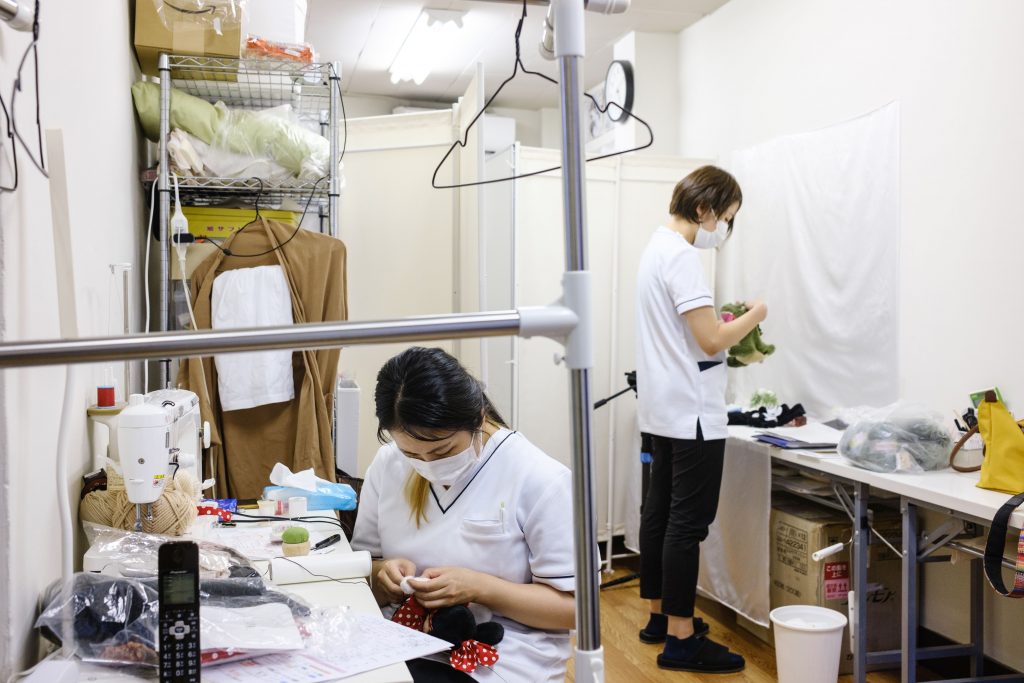 Employees working on stuffed toys at Natsumi Clinic in Tokyo.(File photo/AFP)