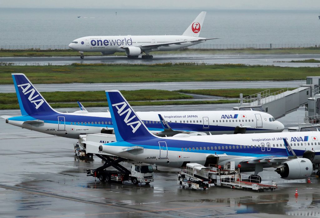 A Japan Airlines (JAL) aircraft takes off near All Nippon Airways (ANA) aircrafts, amid the coronavirus disease (COVID-19) outbreak, at the Tokyo International Airport, commonly known as Haneda Airport in Tokyo, Japan Oct. 23, 2020. (File Photo/Reuters)