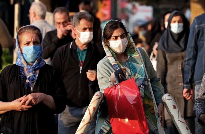 Iranians wear face masks as a COVID-19 coronavirus pandemic precaution in Tehran on October 19, 2020. (File/AFP)