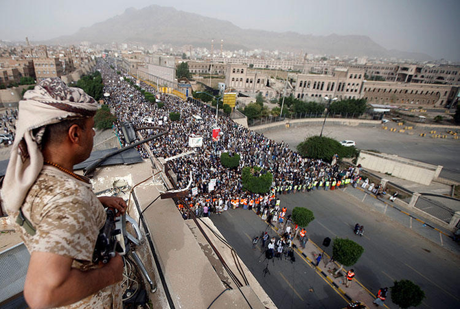 A Houthi fighter secures a rally in Sanaa, Yemen. (Reuters/File)