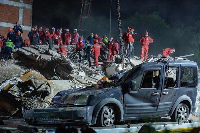 Rescue workers search for survivors in the debris of a collapsed building on November 1, 2020 in Izmir, after a powerful earthquake struck Turkey's western coast and parts of Greece. (AFP)