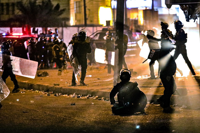 Security forces prevent anti-government protesters from setting up sit in tents in Basra, Iraq, Friday, Nov. 6, 2020. (AP)