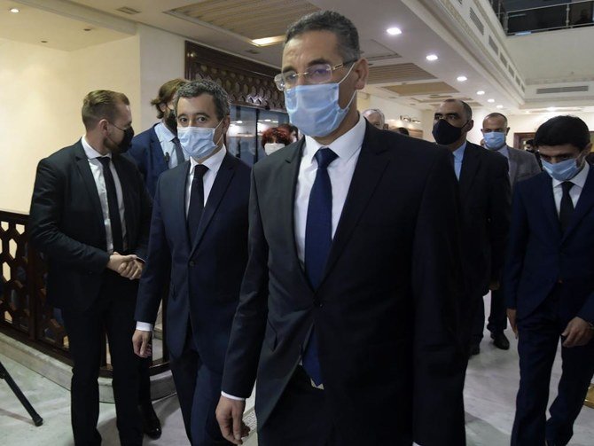 Tunisia's Interior Minister Taoufik Charfeddine (R) receives his French counterpart Gerald Darmanin upon his arrival in the capital Tunis on November 6, 2020. (AFP)