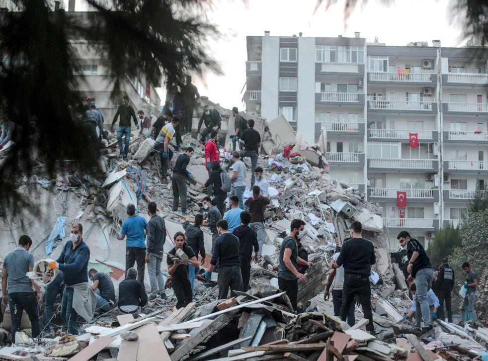 Volunteers clear rubble in Izmir. (AFP)