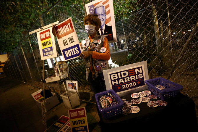 People gather and celebrate in Washington Square Park as they hope for a call in the presidential race for Democratic candidate Joe Biden on Nov. 6, 2020, in New York. (AP Photo/Seth Wenig)