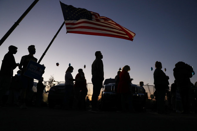 Supporters of Democratic presidential nominee Joe Biden gather near the parking lot at the Chase Center where Mr. Biden was expected to make an announcement to the Nation on Nov. 06, 2020 in Wilmington, Delaware. (Joe Raedle/Getty Images/AFP)