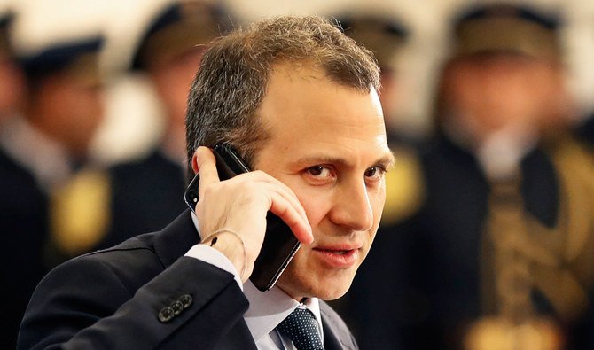 Lebanese Foreign Minister, Gibran Bassil, who is Lebanese president Michel Aoun's son-in-law and heads his Free Patriotic Movement party, speaks on his mobile phone on his arrival to the Lebanese presidential palace, in Baabda, east of Beirut, north Lebanon, Monday, Jan. 29, 2018. (AP)