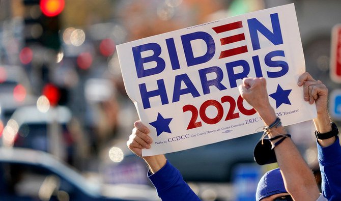 People celebrate the presidential race being called in favor of President-elect Joe Biden over President Donald Trump, Saturday, Nov. 7, 2020, at the Country Club Plaza shopping district in Kansas City, Mo. (AP)