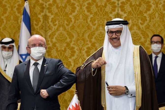 Bahrain Foreign Minister Abdullatif bin Rashid Al-Zayani (right) and head of the Israeli delegation, National Security Advisor Meir Ben Shabbat, bump elbows after a signing ceremony in Manama on Oct 18, 2020. (AFP/File Photo)