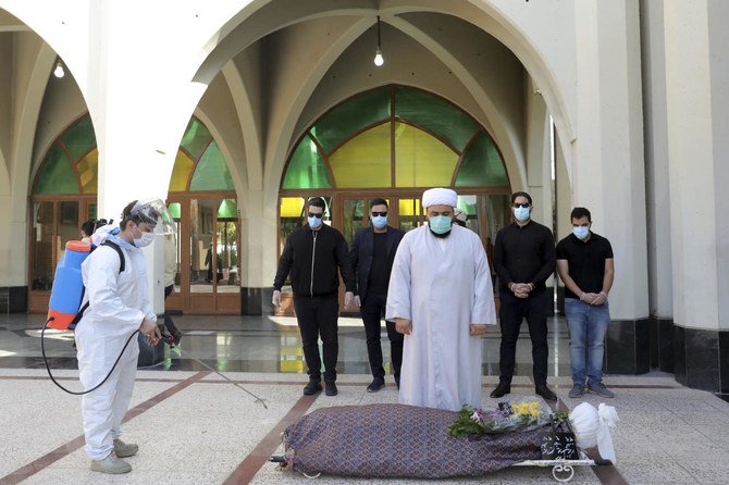 At Behesht-e-Zahra or Zahra’s Paradise in Farsi, named after a daughter of the Prophet Muhammad, the bodies of known coronavirus victims arrive each day by ambulance. Mortuary attendants prepare each body for the ritual washing required for the Muslim dead. (AP Photo/Ebrahim Noroozi)