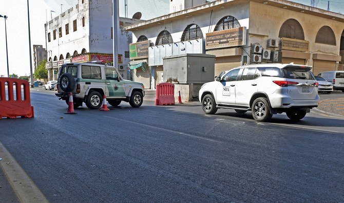 Saudi police close a street leading to a non-Muslim cemetery in Jeddah where a blast, on Nov. 11, 2020. (AFP)