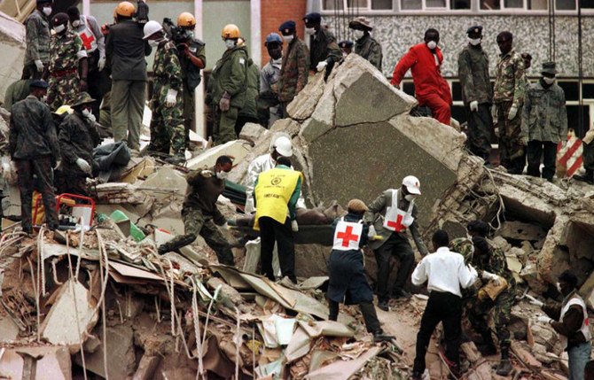 A body is carried on August 9, 1998 from the wreckage in Nairobi, Kenya following the August 7 bombing of a building near the US Embassy. (AFP/Getty Images)