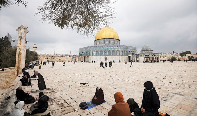 Muslims gather for prayer, next to the Dome of the Rock Mosque in the Al-Aqsa Mosque compound in Jerusalem’s old city. (AP)