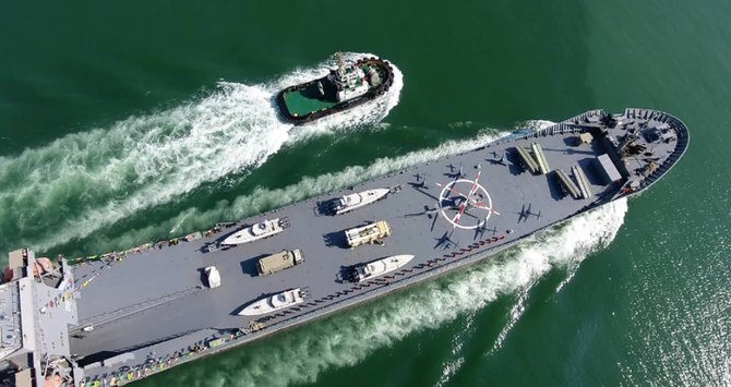 The warship is named after slain Naval commander Abdollah Roudaki, sailing through the waters in the Gulf during it's inauguration. (AFP/Iran's Revolutionary Guard via Sepah News)