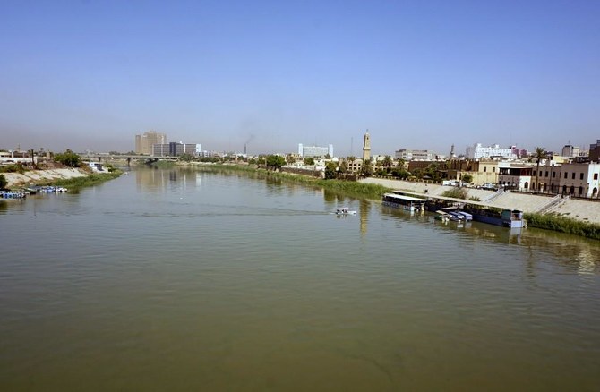 A general view shows the Tigris River running through the Iraqi capital Baghdad, with the Ottoman-era Qishleh clock tower on the right, on September 17, 2020. (File/AFP)