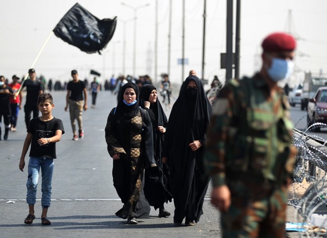 Iraqi Shiite Muslim pilgrims walk at Baghdad's Al-Dora area. (File/AFP)