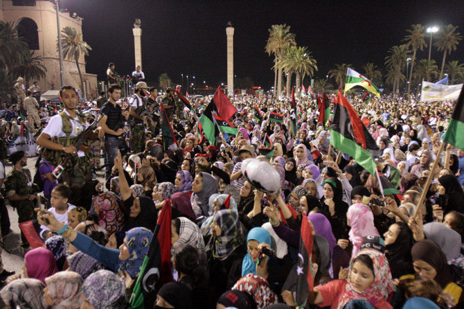 Libyans celebrate during the speech of Mustafa Abdul Jalil, Chairman of the Libyan Transitional Council, at the Martyrs' Square, in Tripoli on September 13, 2011. (AFP / Mahmud Turkia)