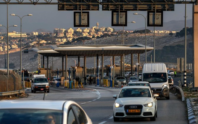 This picture taken on November 25, 2020 shows a view of al-Zaim checkpoint on the outskirts of east Jerusalem, while behind is seen the Israeli settlement of Maale Adumim in the occupied West Bank on Jerusalem's outskirts. (AFP)