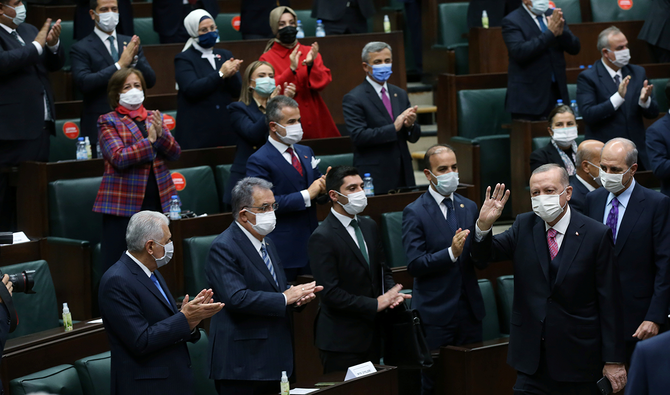 Turkish President Tayyip Erdogan greets members of his ruling AKP during a meeting at the parliament in Ankara, Turkey, November 25, 2020. (Reuters)