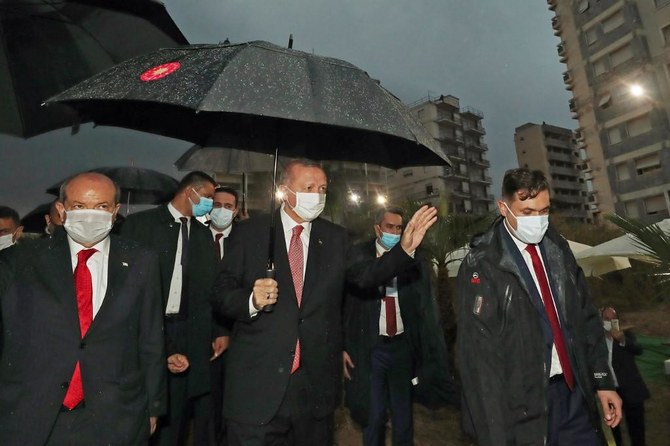 Erdogan (C) and Turkish Cypriot leader Ersin Tatar (L) arrive to make a joint statement in Varosha, in the Turkish-held north of the divided Mediterranean island of Cyprus, on November 15, 2020. (AFP)
