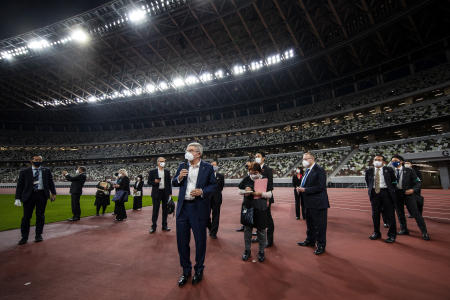 IOC President Thomas Bach (center) visits the National Stadium, the main venue for the 2020 Olympic and Paralympic Games postponed until July 2021 due to the coronavirus pandemic, in Tokyo Tuesday, Nov. 17, 2020. (AP)