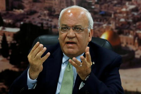 Chief Palestinian negotiator Saeb Erekat gestures as he speaks to the media in Ramallah, in the Israeli-occupied West Bank on July 1, 2019. (Reuters)
