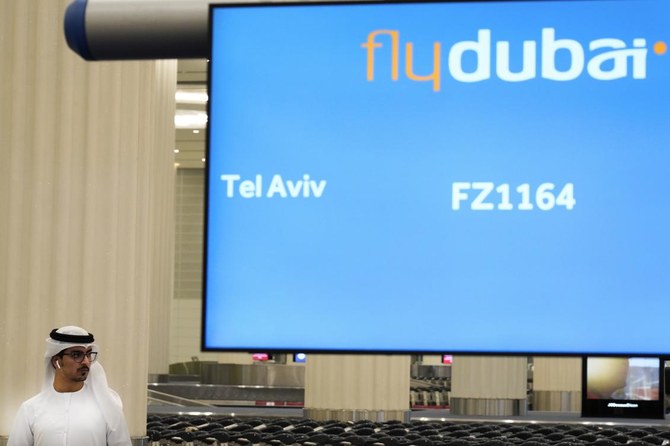 An Emirati journalist awaits a flyDubai flight from Tel Aviv, Israel, at Dubai International Airport's Terminal 3 in Dubai, United Arab Emirates, Thursday, Nov. 26, 2020. (AP)