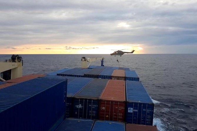 A German soldier lands from a helicopter on a Turkish cargo ship on November 23, 2020 at east Mediterranean sea. (AFP)
