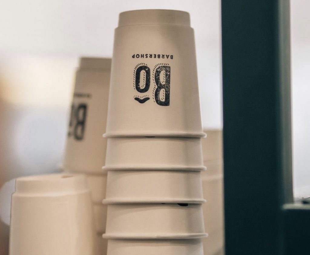 Bô Barbershop uses recyclable coffee cups as an eco-friendly solution to supplying their customers with in-house made coffee drinks. (Bô Barbershop)