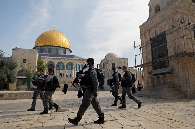 Israeli forces patrol the al-Aqsa mosque compound, Islam's third holiest site, in the Old City of Jerusalem, as Palestinians stage protest (unseen) against comments by French President Emmanuel Macron defending cartoons of the Prophet Mohammed, on October 30, 2020. (AFP)