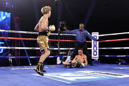 Japanese boxer Naoya Inoue (left) reacts after knocking down Australian boxer Jason Moloney during their bantamweight title bout at MGM Grand Conference Center on October 31, 2020 in Las Vegas, Nevada. (AFP)