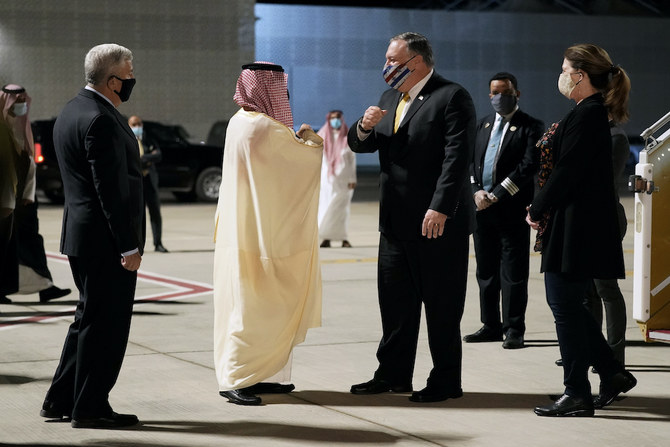 Foreign Minister Faisal bin Farhan and US Ambassador to Saudi Arabia John Abizaid greet Secretary of State Mike Pompeo and his wife Susan as they arrive at Neom Bay Airport in Saudi Arabia. (AP)