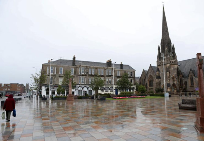 A woman walks in a pedestrian precinct in Helensburgh, Scotland, Britain, July 22, 2020. (Reuters)