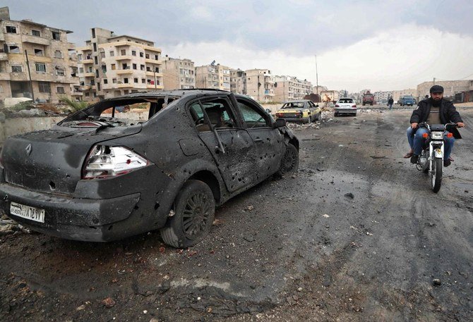 A picture taken on November 4, 2020 shows a burnt car following heavy shelling by Syrian government forces on the industrial area in the rebel-held northwestern Syrian city of Idlib. (AFP)