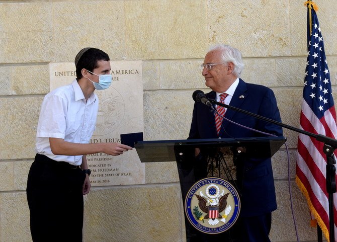 The US Ambassador to Israel presents Menachem Zivotofsky, a US citizen who was born in Jerusalem, his passport that lists Israel as birthplace at the US Embassy in Jerusalem. (File/Reuters)