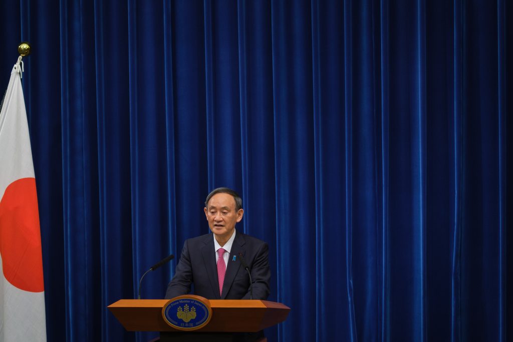 Japan's Prime Minister Yoshihide Suga speaks during a press conference on the COVID-19 coronavirus in Tokyo on December 25, 2020. (AFP)