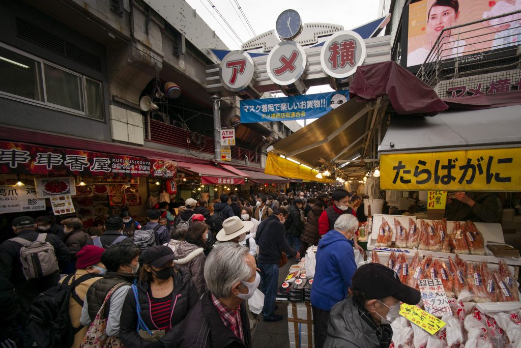 People visit shops to purchase food and supplies to celebrate the New Year in Tokyo's shopping district Ueno on December 29, 2020. (AFP)