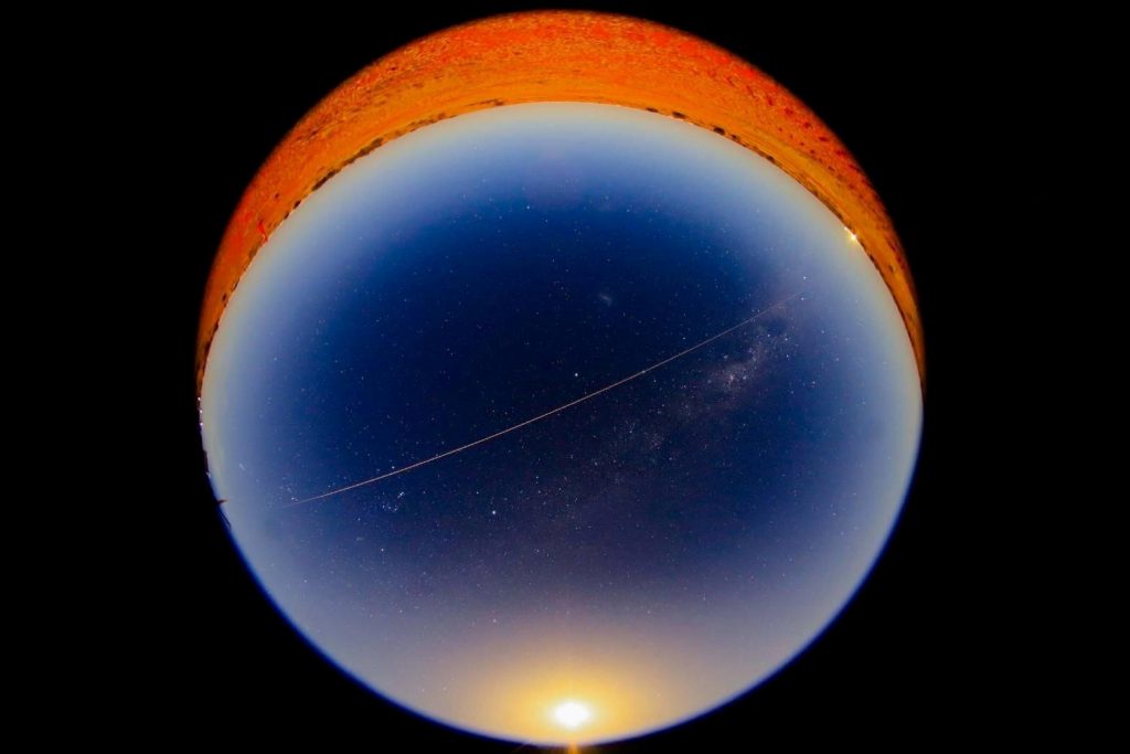 In this handout image from Japan Aerospace Exploration Agency (JAXA), a fireball from Hayabusa2's capsule carrying the first extensive samples of an asteroid is seen as it reentered the earth's atmosphere while it is observed at Coober Pedy, Australia, December 6, 2020. Japan Aerospace Exploration Agency (JAXA)/Handout via Reuters