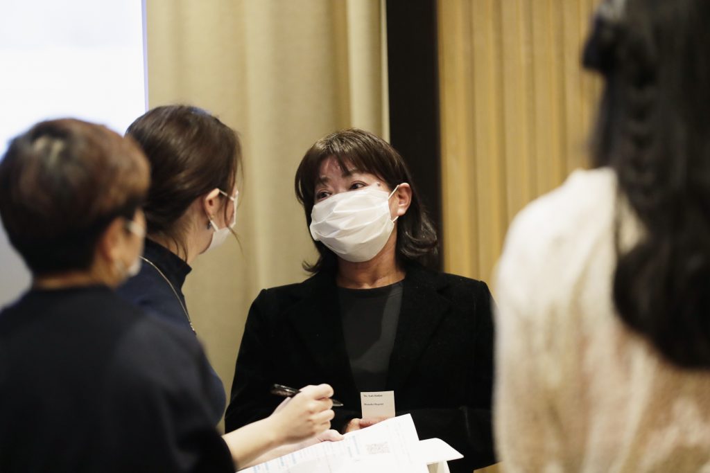 Shoko Arai, a former councilwoman in Kusatsu town, northwest of Tokyo, takes a question from a reporter after a news conference in Tokyo Friday, Dec. 18, 2020. Arai who was ousted from an assembly in the old Japanese hot springs town after accusing Mayor Nobutada Kuroiwa of sexual assault said Friday that her case highlighted problems of small town politics in Japan dominated by local male heavyweights and women are easily silenced. Arai, who was the only woman in a 12-member assembly in the town was voted out of office in a Dec. 6 referendum initiated by the mayor and his supporters who campaigned for her removal. (AP Photo/Hiro Komae)