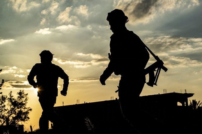 Iran-backed Iraqi paramilitary groups helped retrieve the bodies. (File/AFP)