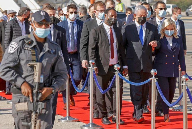 Benjamin Netanyahu and his wife Sarah arrive at a ceremony to welcome Ethiopian Jewish immigrants making their Aliyah (Immigration to Israel) at Ben Gurion International Airport, Tel Aviv, Dec. 3, 2020. (AFP)