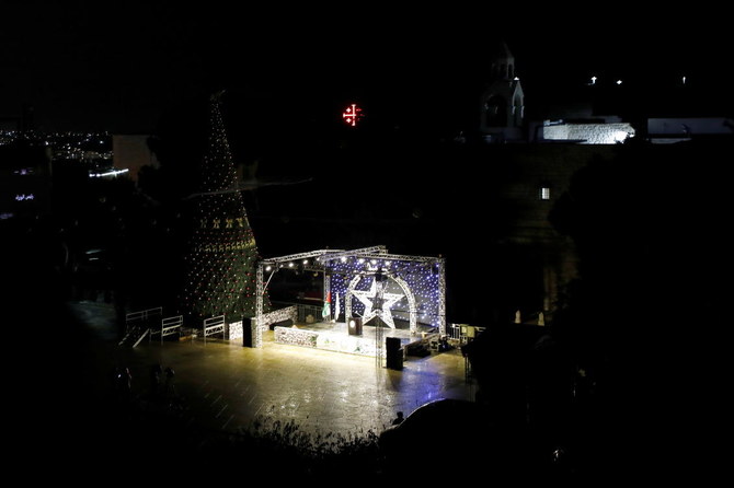 Christmas tree is seen at Manger Square outside the Church of the Nativity, amid the coronavirus disease (COVID-19) outbreak, in Bethlehem in the Israeli-occupied West Bank December 5, 2020. (Reuters)