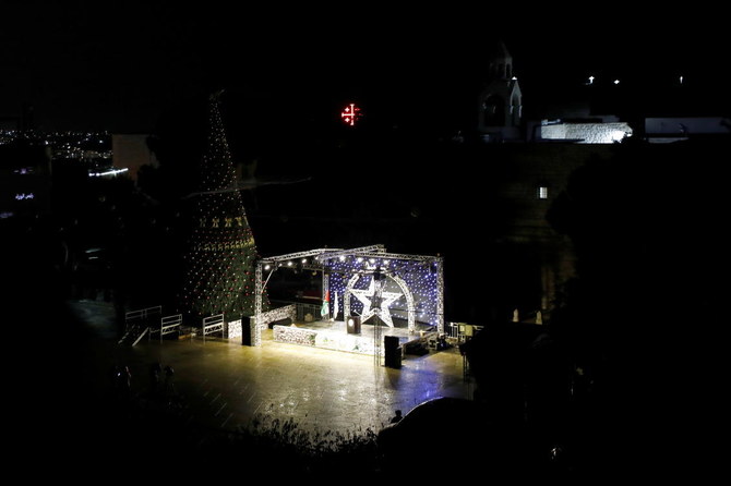 Christmas tree is seen at Manger Square outside the Church of the Nativity, amid the coronavirus disease (COVID-19) outbreak, in Bethlehem in the Israeli-occupied West Bank December 5, 2020. (Reuters)