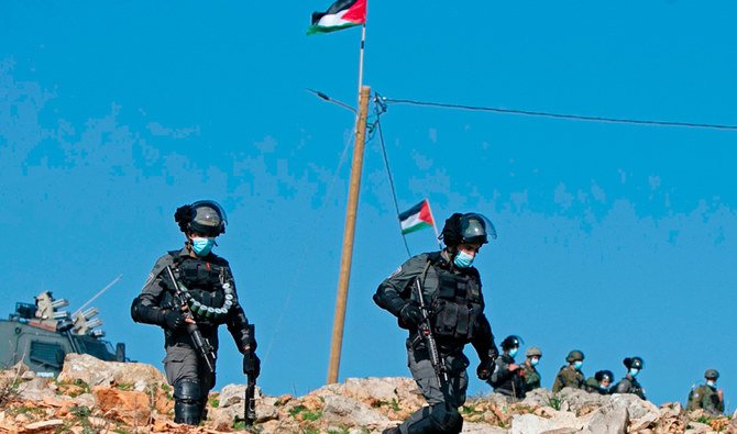 Members of Israeli security forces deploy amid clashes with Palestinian protesters following a demonstration against the expansion of settlements in the town of Salfit, in the Israeli-occupied West Bank, on December 4, 2020. (AFP)